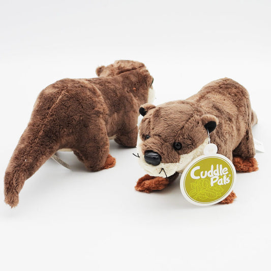 Two plush otters with a 'Cuddle Pals' tag 