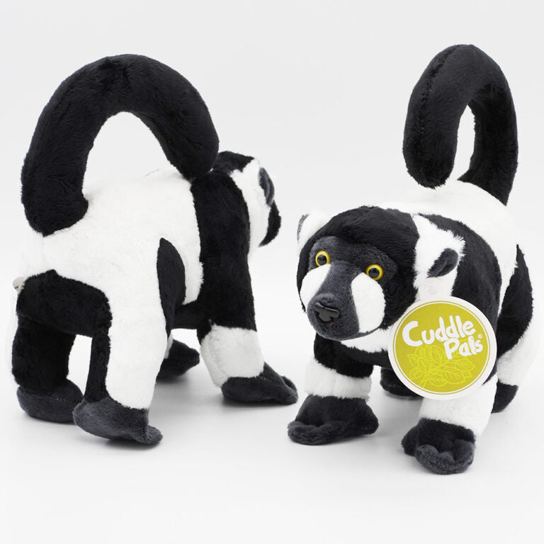 Black and white plush toy with 'Cuddle Pals' label on a white background